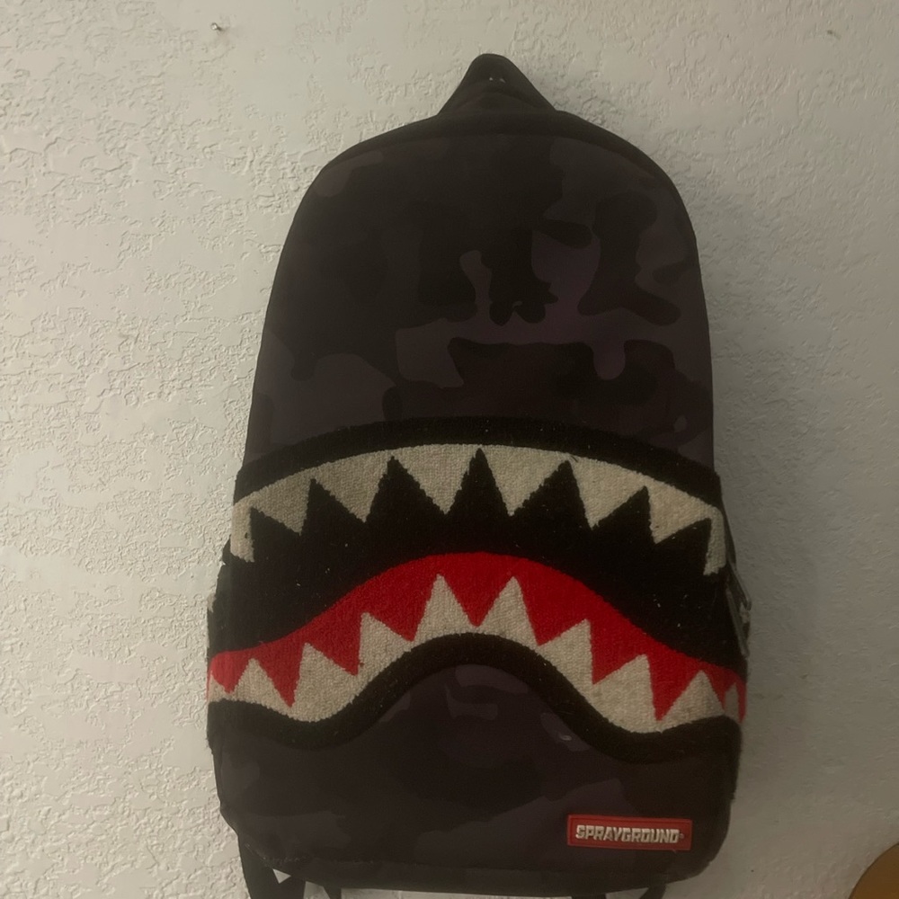 Spray ground backpack